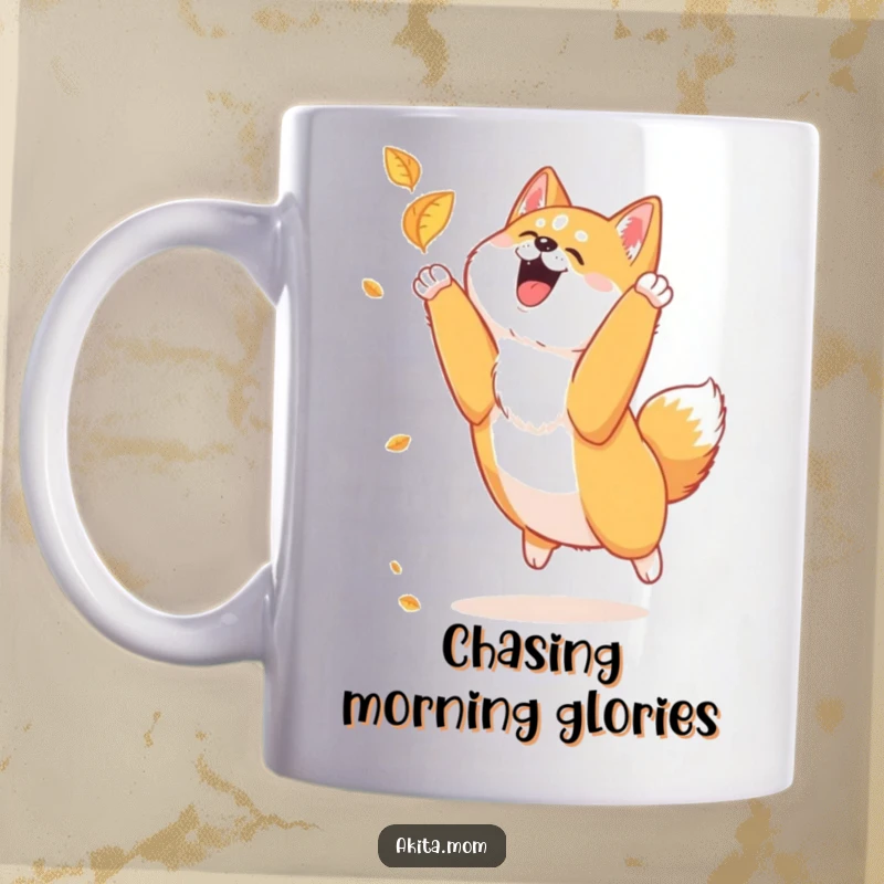 Funny Akita mug showing a loyal Akita joyfully leaping high to catch a falling autumn leaf with pure delight.