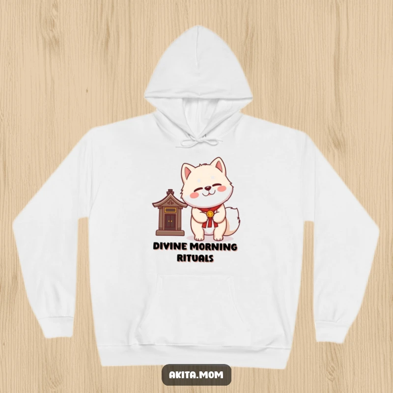 Funny Kawaii Akita hoodie with a dignified wink, standing gracefully next to a miniature shrine, offering comfort and good fortune.