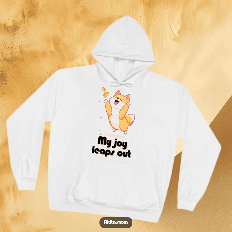 Funny Akita hoodie showcasing a loyal Akita joyfully leaping to catch a falling leaf, capturing the essence of playful energy.