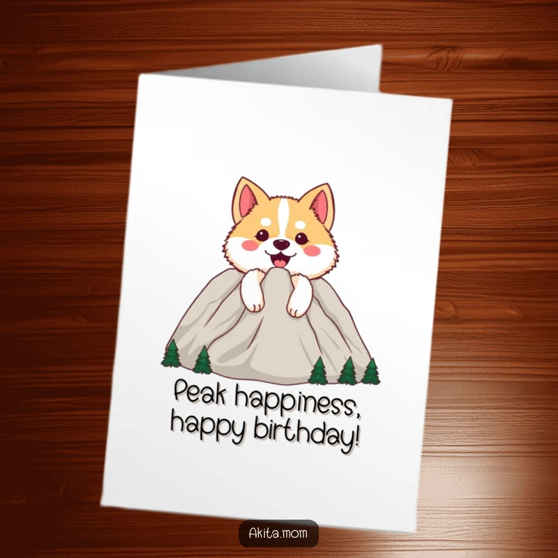 Funny Free Printable Birthday Card: Happy Akita peeking from behind a cheerful mountain, offering warm wishes and a smile.