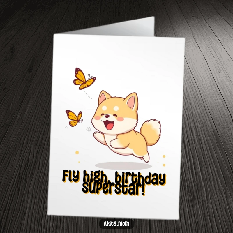 Funny Free Printable Birthday Card featuring a cute Akita cub leaping joyfully while chasing a fluttering butterfly.