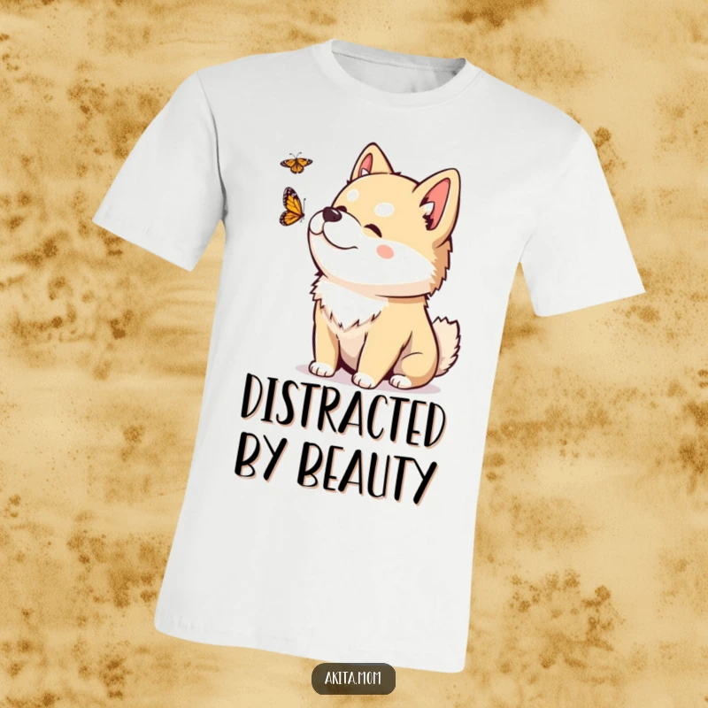 Funny Kawaii Akita t-shirt with a playful head tilt, curiously observing a fluttering butterfly in a moment of gentle wonder.
