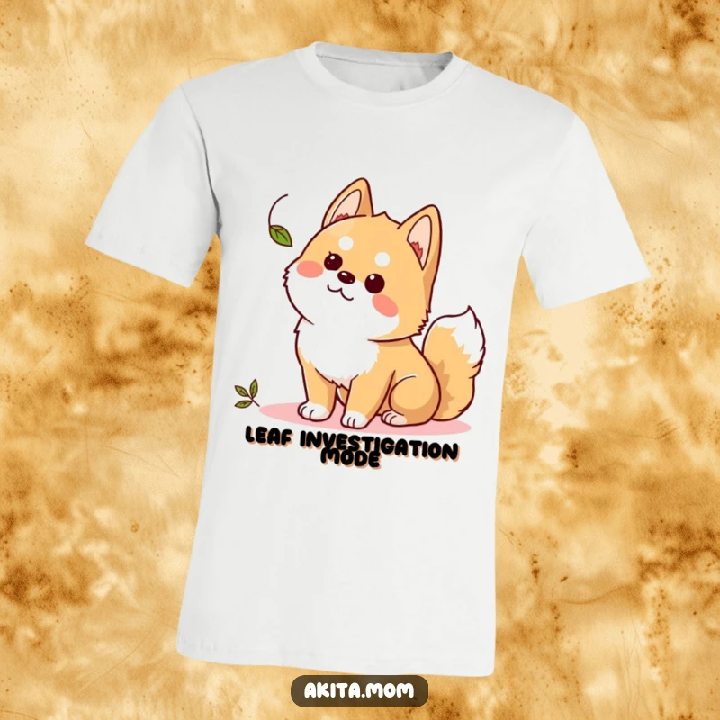 Funny Kawaii Akita t-shirt, a cute dog in an alert stance, captivated by a floating leaf, full of curiosity.