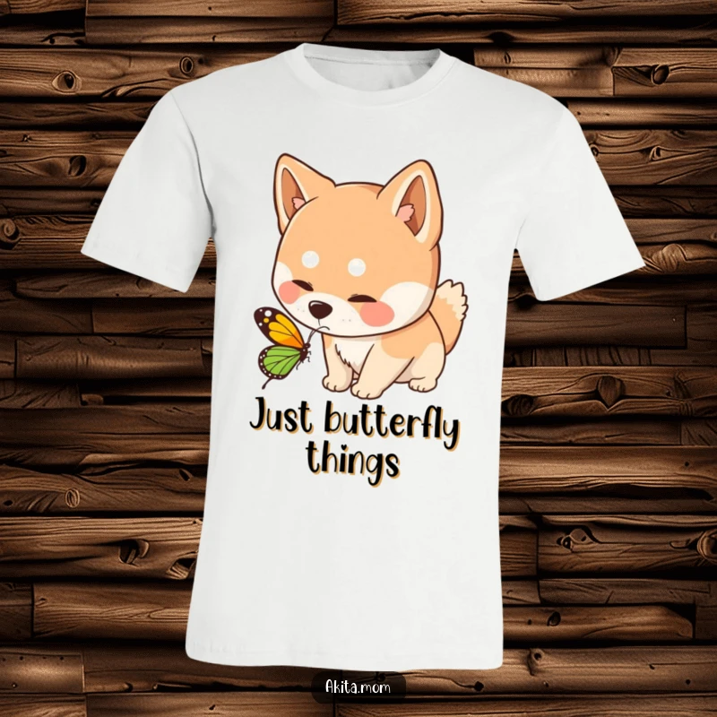 Funny Kawaii Akita dog t-shirt, depicting a curious sniff towards a butterfly, embodying gentle interaction and nature's charm.