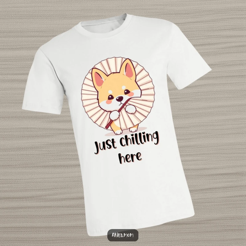 Funny Kawaii Akita dog t-shirt, depicting a cute peek from behind a large fan, embodying playful curiosity and humor.