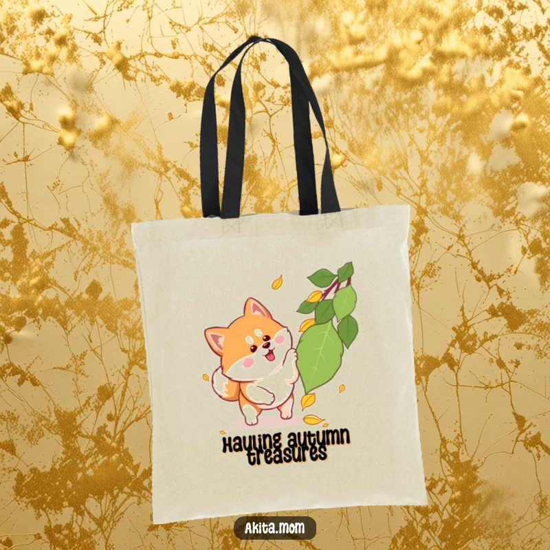 Funny Kawaii Akita tote bag featuring a lively dog with alert ears playfully leaping at a single falling leaf, embodying autumn's carefree spirit.